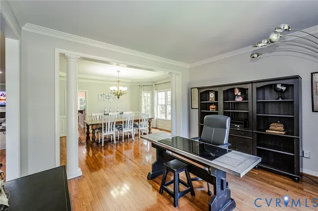a workspace with furniture and wooden floor