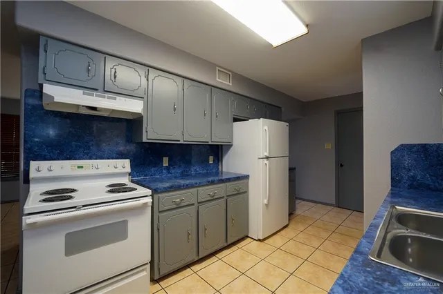 a view of kitchen with furniture and cabinets