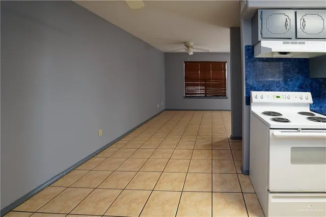a view of a kitchen with cabinets and black stainless steel appliances