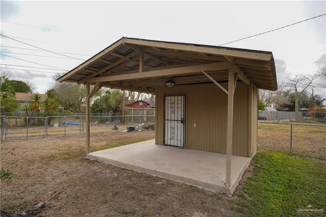 a view of a house with backyard porch and sitting area