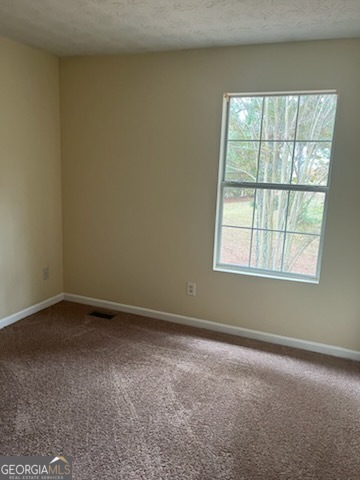 5793 Wind Gate Lane Lithonia, GA 30058 - Photo 11 of 24 an empty room with a window