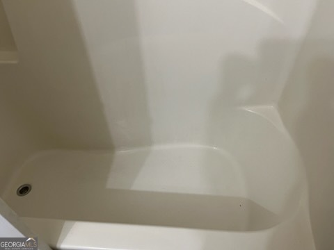 5793 Wind Gate Lane Lithonia, GA 30058 - Photo 12 of 24 a bathroom with a bathtub