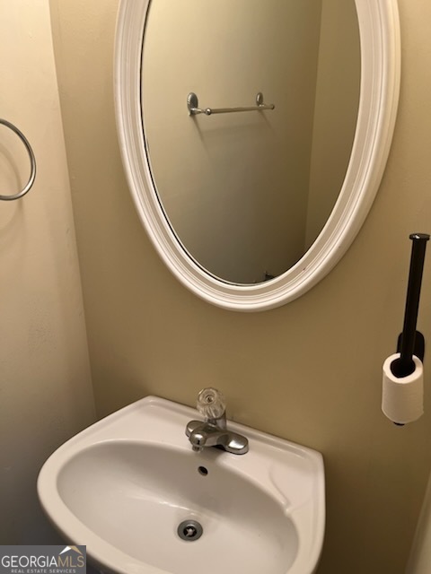 5793 Wind Gate Lane Lithonia, GA 30058 - Photo 20 of 24 a bathroom with a sink and mirror
