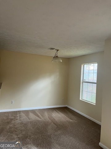 5793 Wind Gate Lane Lithonia, GA 30058 - Photo 22 of 24 an empty room with windows and fan