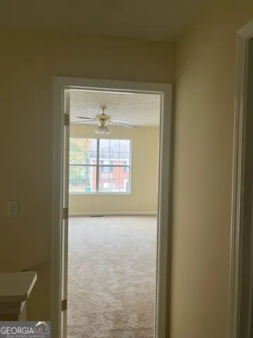 a view of an empty room and window