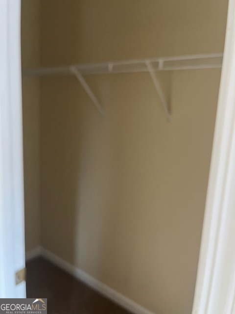 5793 Wind Gate Lane Lithonia, GA 30058 - Photo 9 of 24 a view of a room with racks on the wall