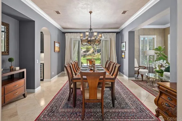 a kitchen with granite countertop cabinets and chairs