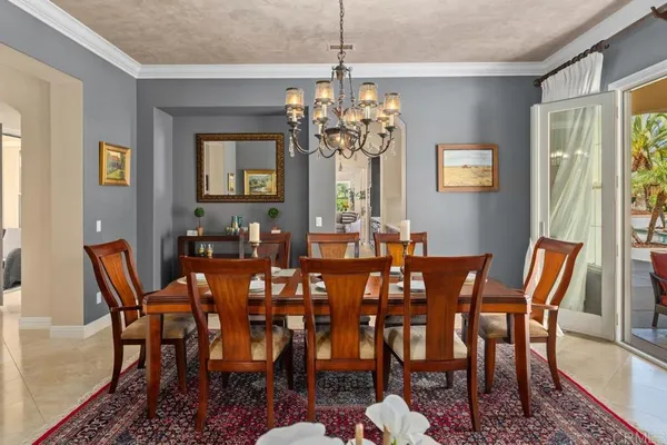 a kitchen with stainless steel appliances granite countertop a stove a sink dishwasher a refrigerator white cabinets and wooden floor