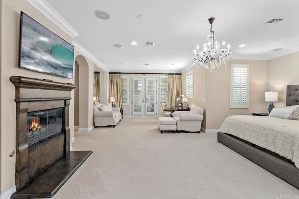 a bedroom with a bed dresser and a window