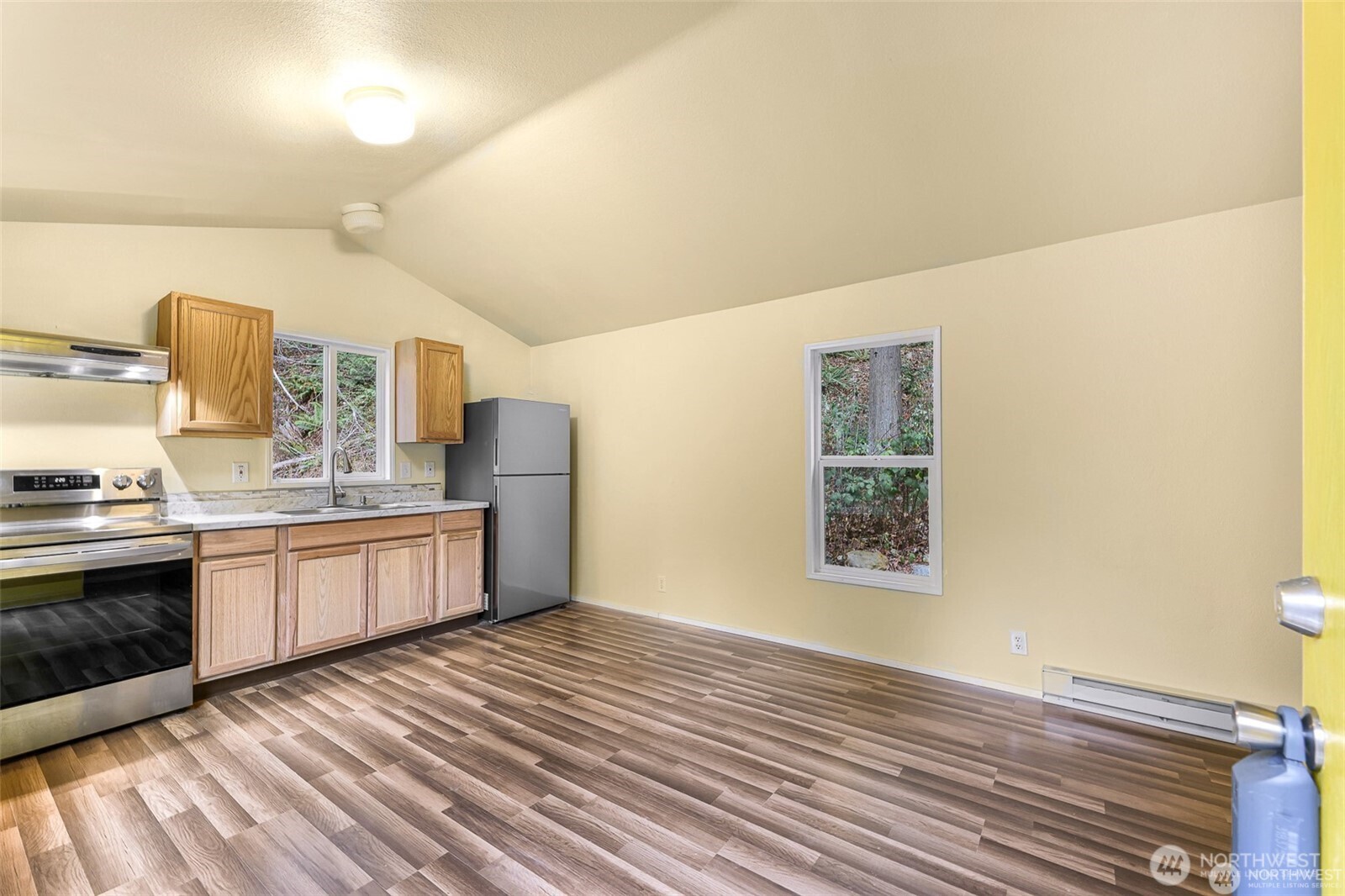 4220 Bray Way Bellingham, WA 98226 - Photo 4 of 9 a kitchen with stainless steel appliances granite countertop a sink cabinets and wooden floor