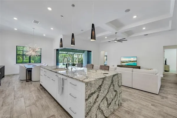 a kitchen with sink cabinets and window