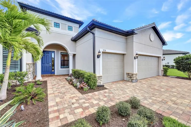 a view of a house with a yard and plants
