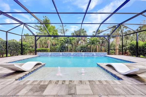 a view of swimming pool with a yard