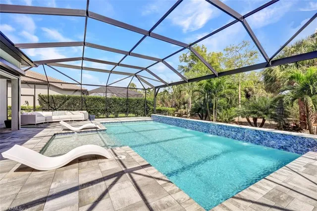 a view of a backyard with sitting area