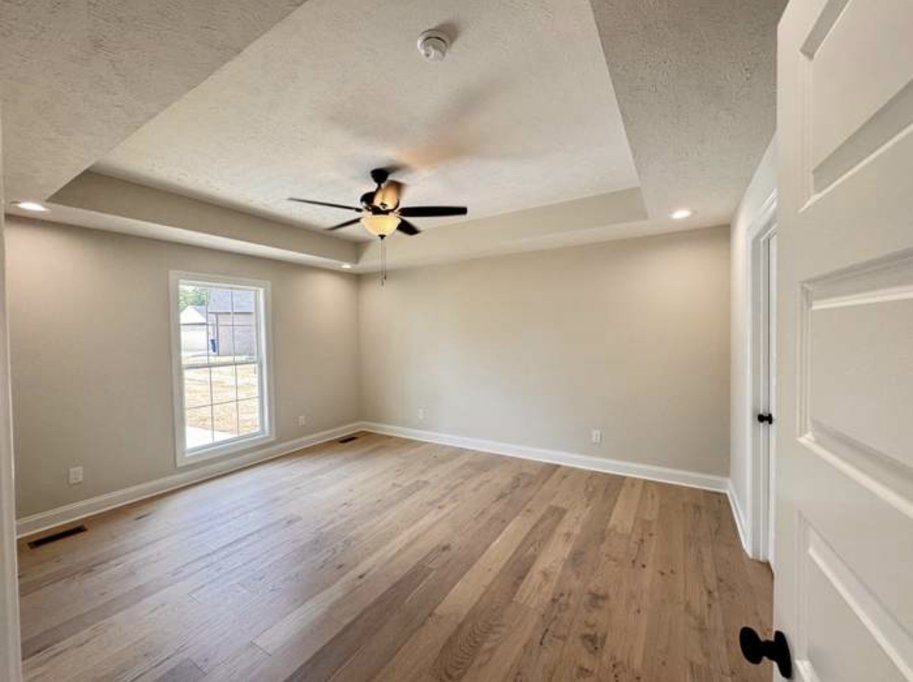 2105 Maple Grove Road Cadiz, KY 42211 - Photo 6 of 13 an empty room with wooden floor and windows