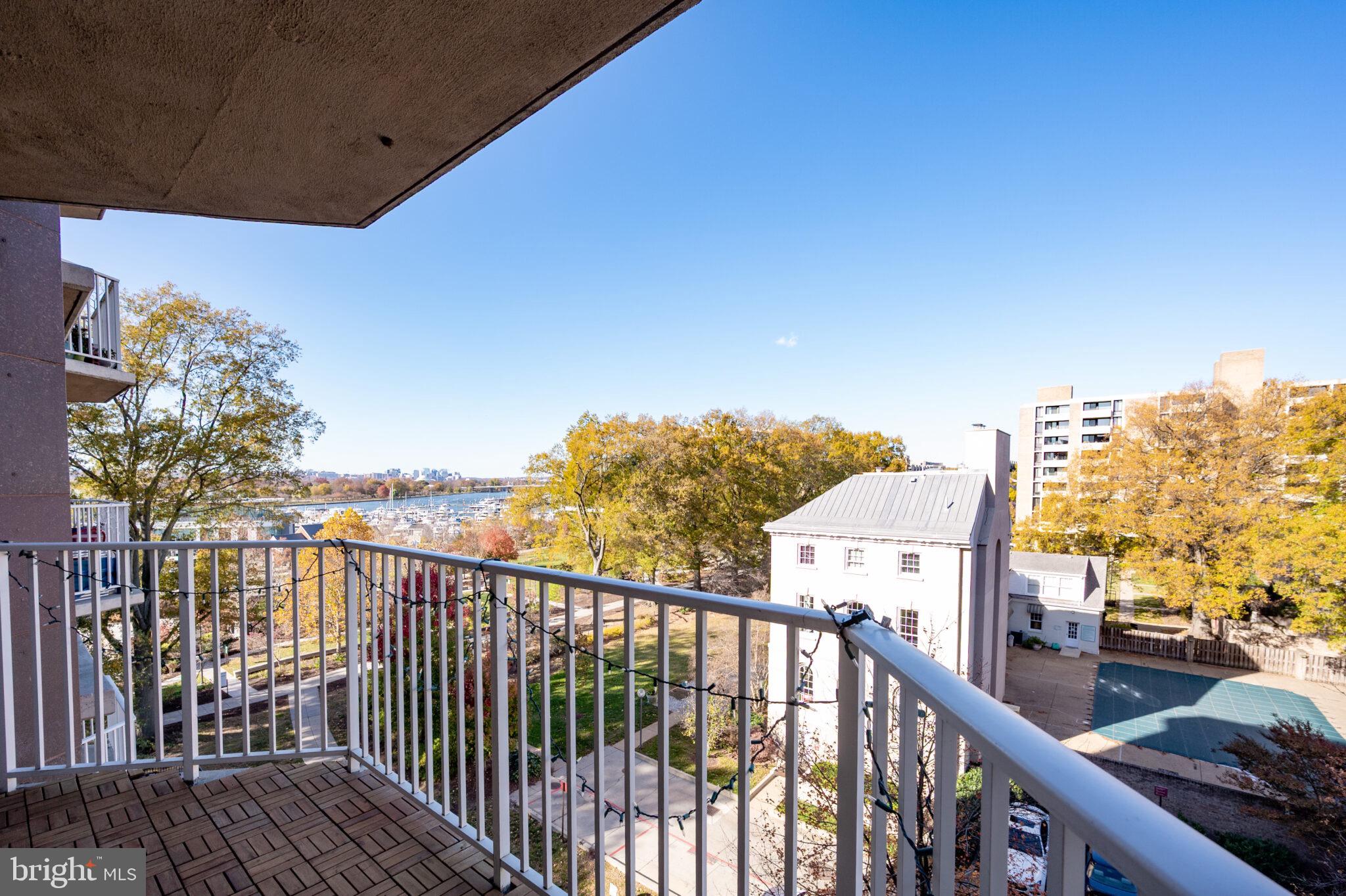 560 N Street Southwest, Unit N503 Washington, DC 20024 - Photo 20 of 35 a view of a balcony with wooden floor and city view