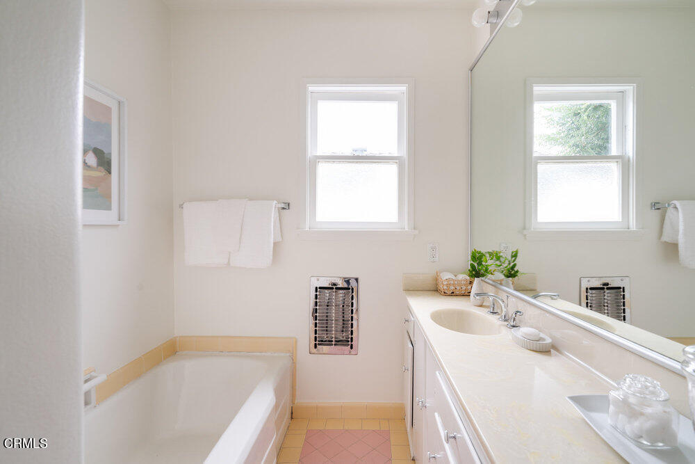 126 West Pine Street Altadena, CA 91001 - Photo 15 of 21 a bathroom with a tub sink and mirror