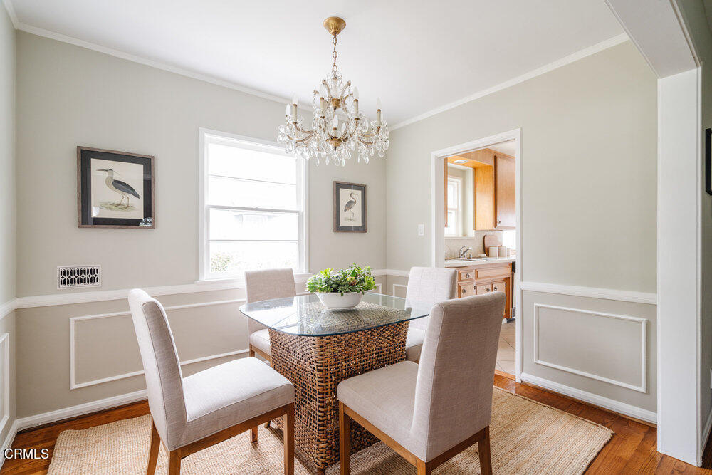 126 West Pine Street Altadena, CA 91001 - Photo 6 of 21 a dining room with furniture a chandelier and wooden floor