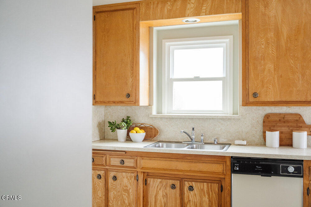 126 West Pine Street Altadena, CA 91001 - Photo 7 of 21 a kitchen with a sink and cabinets