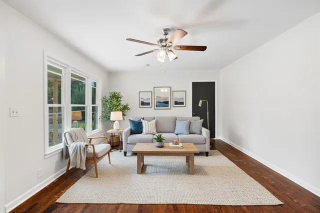 a living room with furniture and a rug