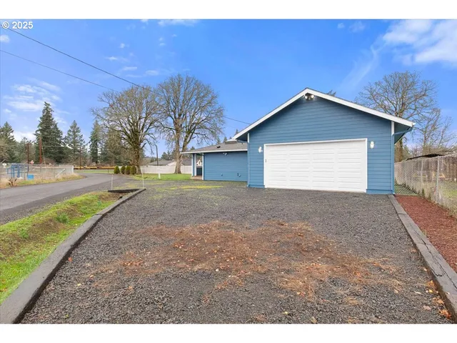 a view of a backyard of the house
