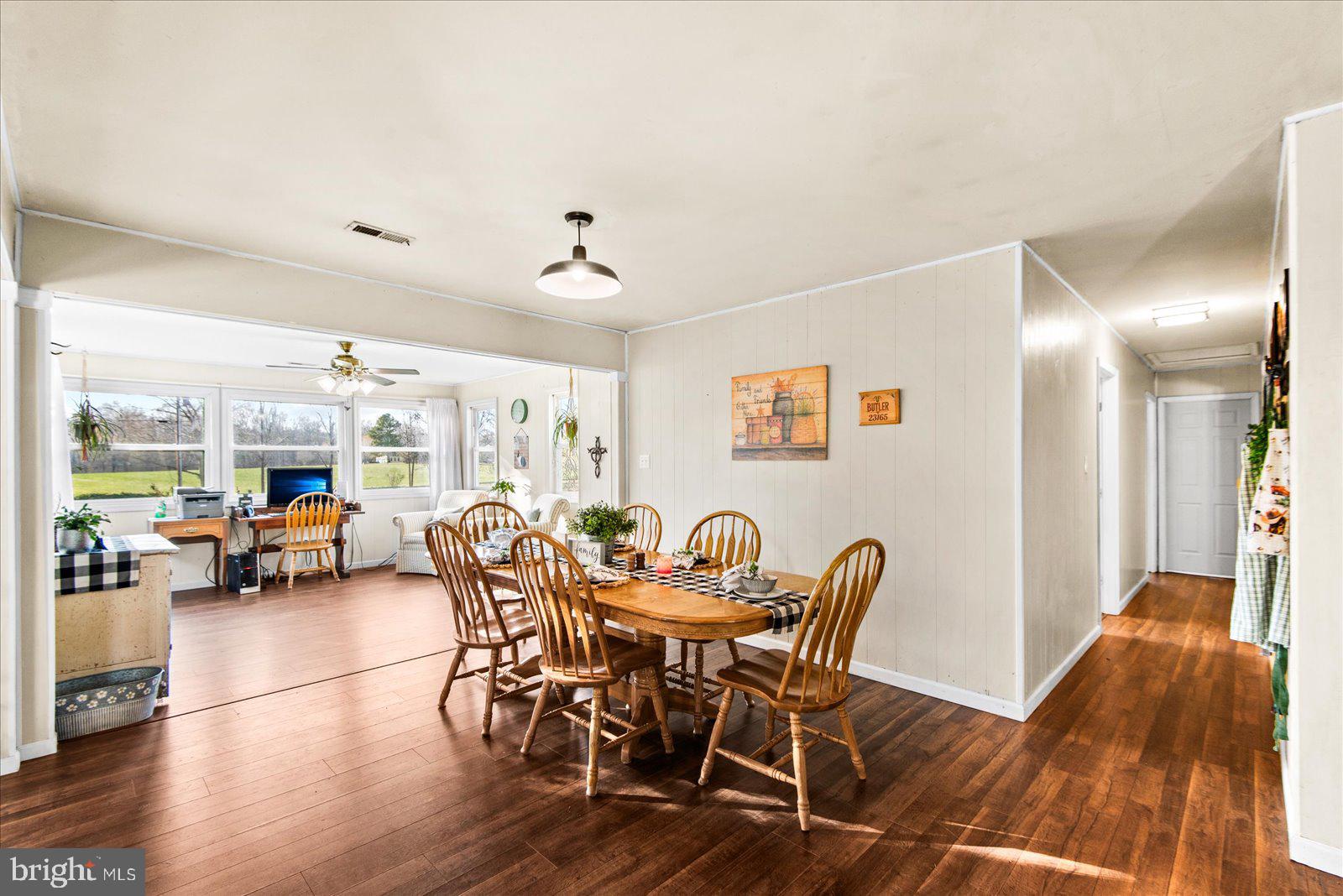 23165 Fork Bridge Road Milford, VA 22514 - Photo 11 of 51 a view of a dining room with furniture and wooden floor