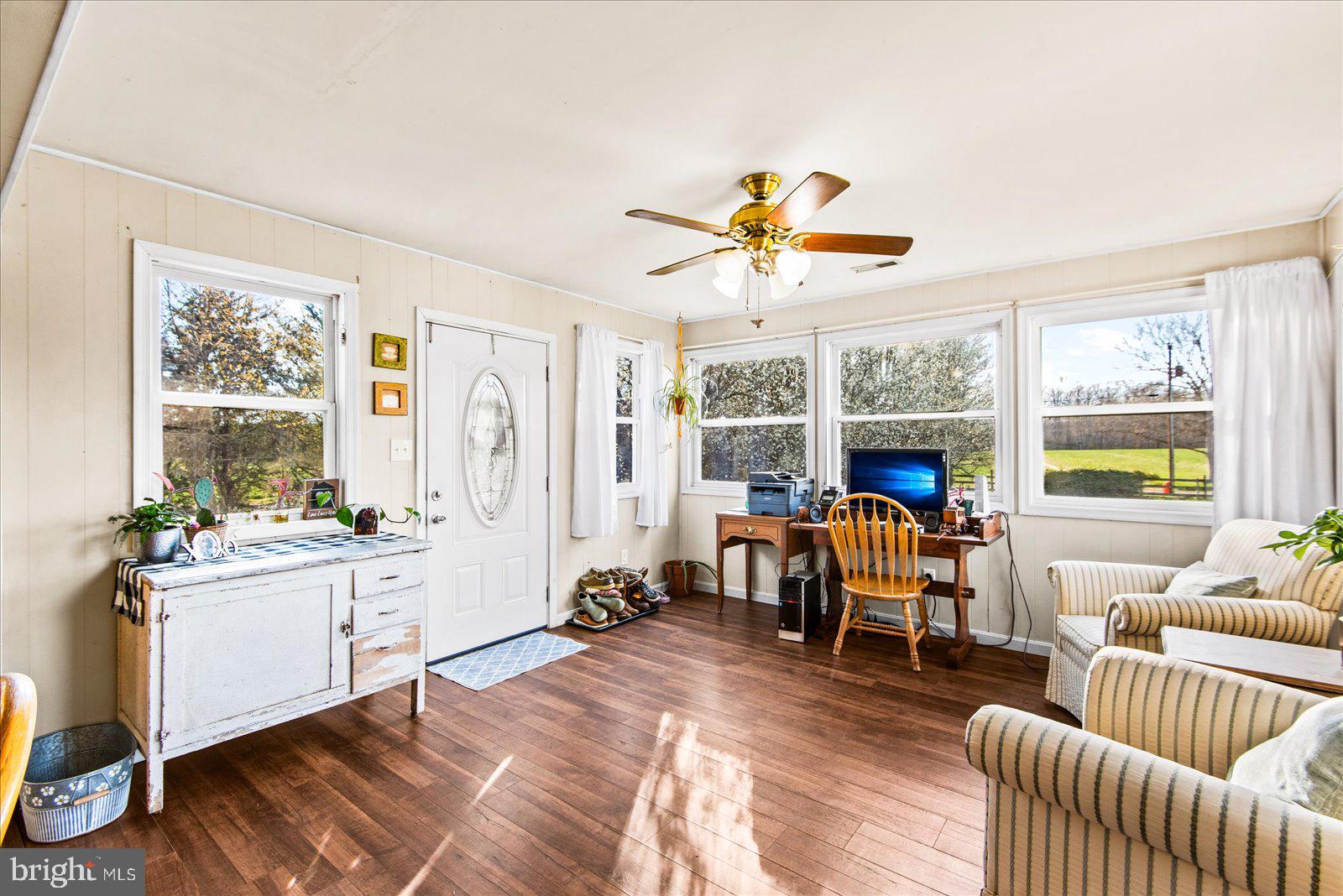 23165 Fork Bridge Road Milford, VA 22514 - Photo 15 of 51 a living room with furniture fireplace and a large window