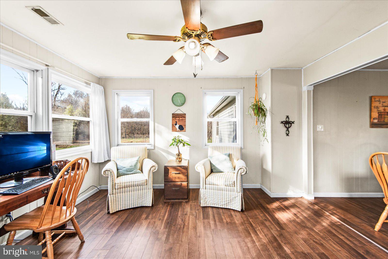 23165 Fork Bridge Road Milford, VA 22514 - Photo 16 of 51 a living room with furniture and wooden floor