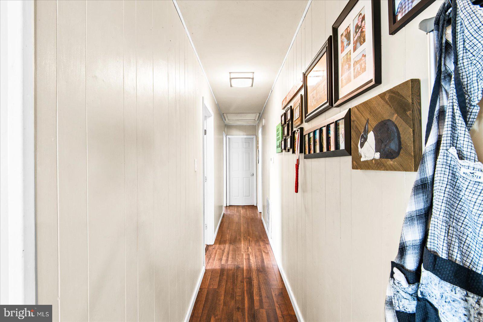 23165 Fork Bridge Road Milford, VA 22514 - Photo 17 of 51 a view of a hallway with wooden floor and entryway