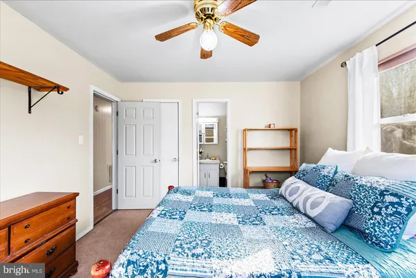 a view of a hallway with wooden floor and entryway
