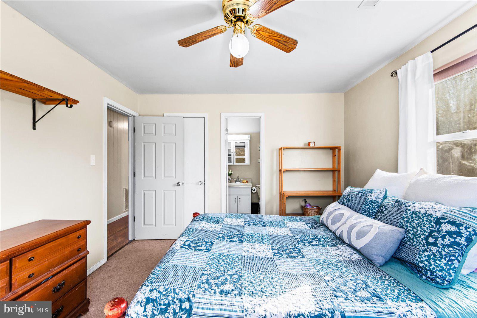 23165 Fork Bridge Road Milford, VA 22514 - Photo 18 of 51 a bedroom with a bed and a dresser