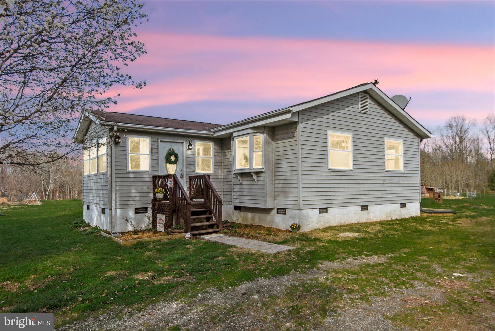 23165 Fork Bridge Road Milford, VA 22514 - Photo 2 of 51 a front view of a house with garden