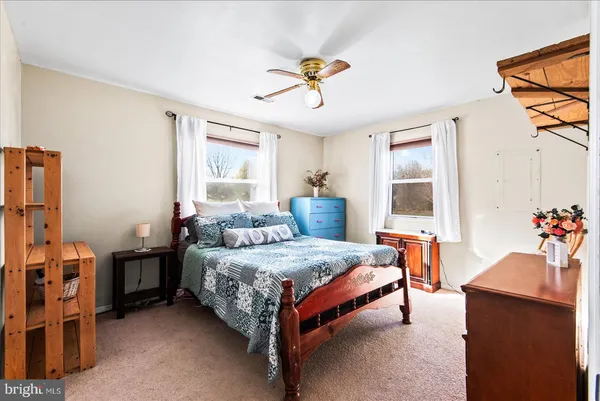 a bedroom with a bed and a dresser