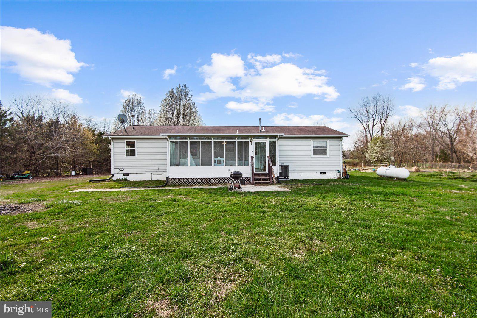 23165 Fork Bridge Road Milford, VA 22514 - Photo 28 of 51 a view of a house with a backyard