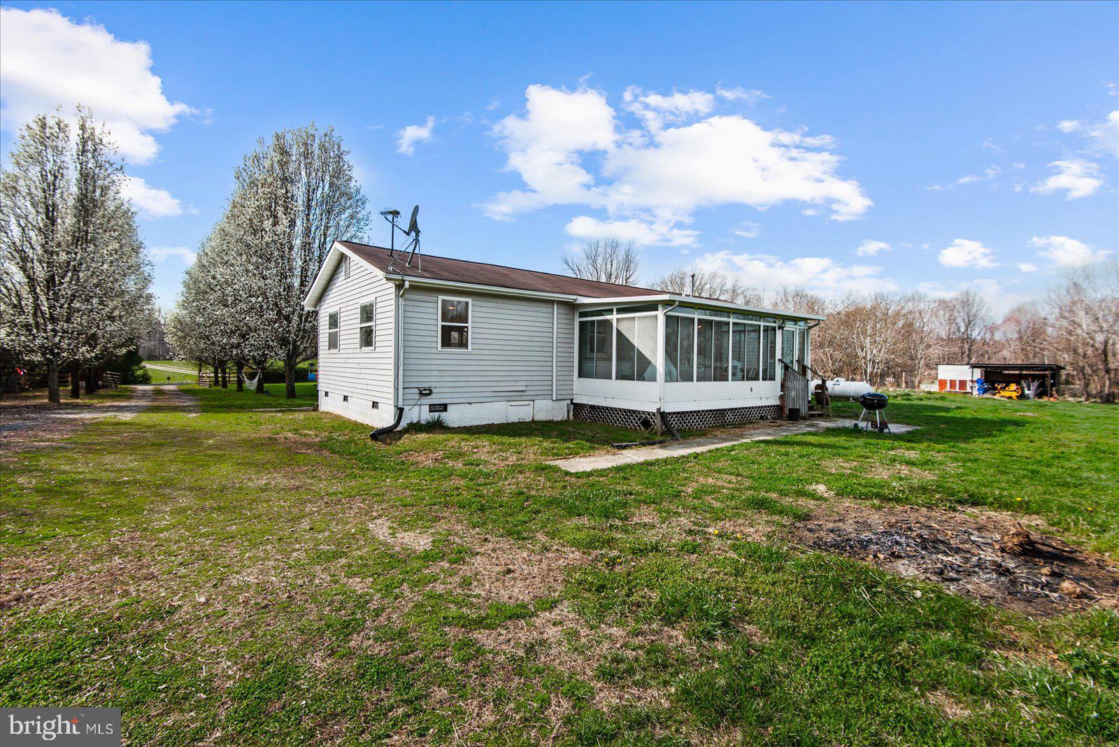 23165 Fork Bridge Road Milford, VA 22514 - Photo 30 of 51 a view of a house with a backyard