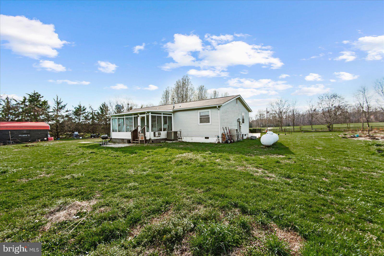 23165 Fork Bridge Road Milford, VA 22514 - Photo 32 of 51 a view of a house with a yard