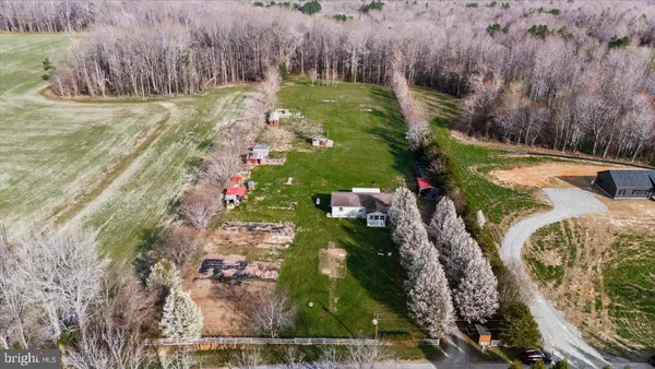 a pathway of a house with a yard