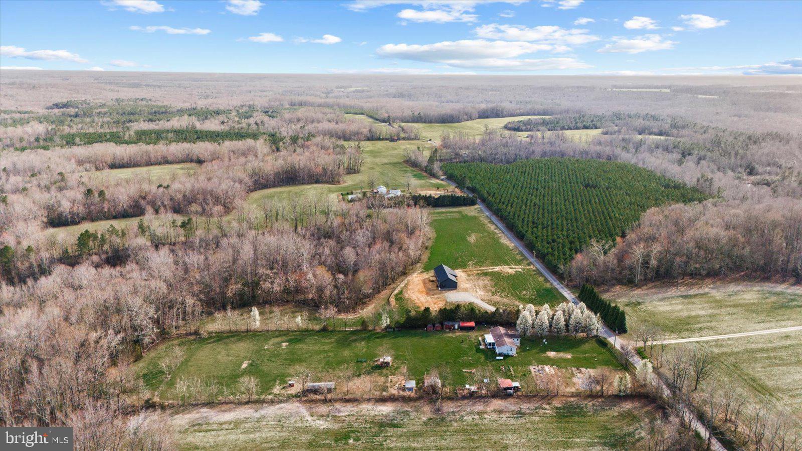 23165 Fork Bridge Road Milford, VA 22514 - Photo 42 of 51 an aerial view of a house with a garden and lake view