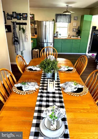 a view of a patio with dining table and chairs