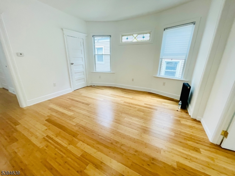 169 Hillside Avenue, Unit 2 Glen Ridge, NJ 07028 - Photo 2 of 10 a view of empty room with wooden floor