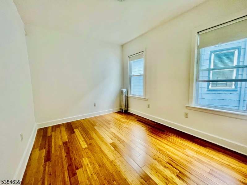 169 Hillside Avenue, Unit 2 Glen Ridge, NJ 07028 - Photo 5 of 10 a view of an empty room and window