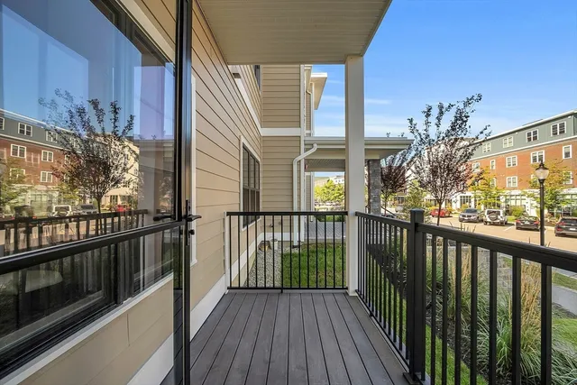 a view of a balcony with wooden floor