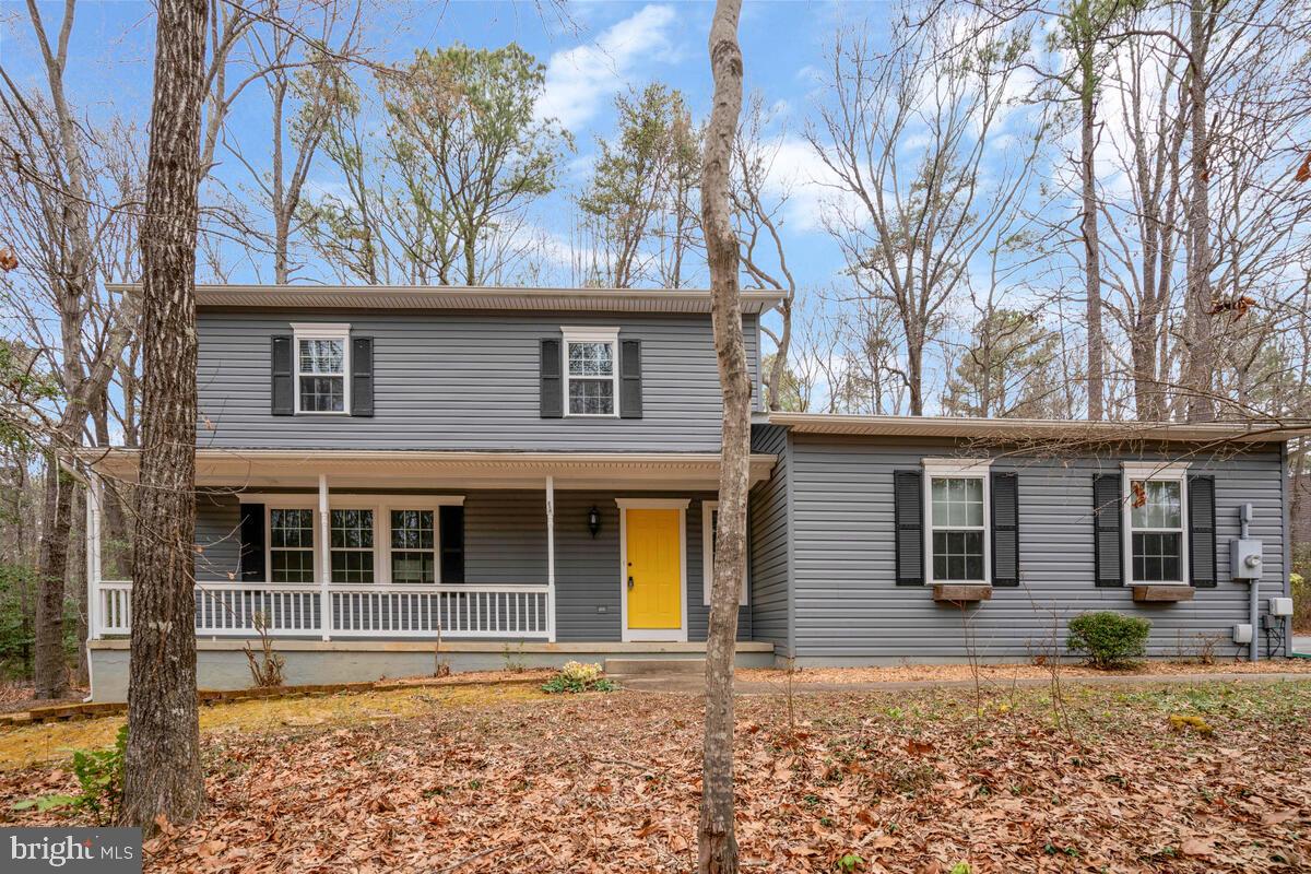 44576 Cedar Court California, MD 20619 - Photo 1 of 45 a house that has a tree in front of the house