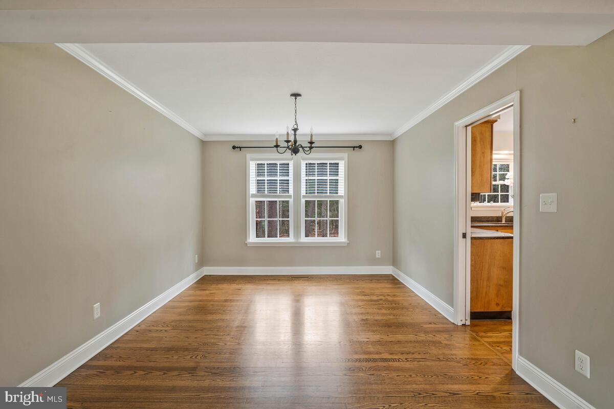 44576 Cedar Court California, MD 20619 - Photo 12 of 45 a view of an empty room with wooden floor and a window