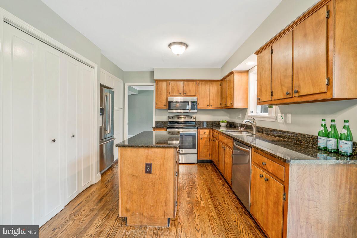 44576 Cedar Court California, MD 20619 - Photo 13 of 45 a kitchen with stainless steel appliances granite countertop a stove a sink dishwasher and a refrigerator