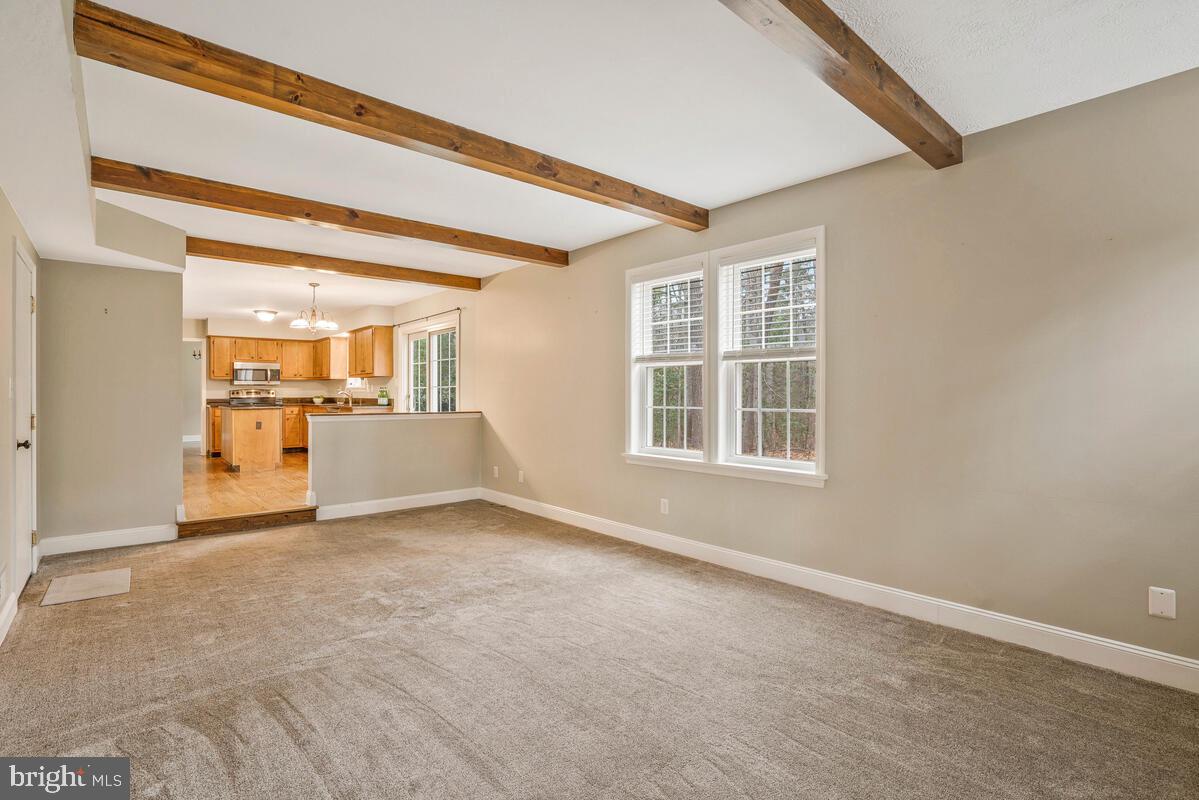 44576 Cedar Court California, MD 20619 - Photo 20 of 45 an empty room with a fireplace and windows