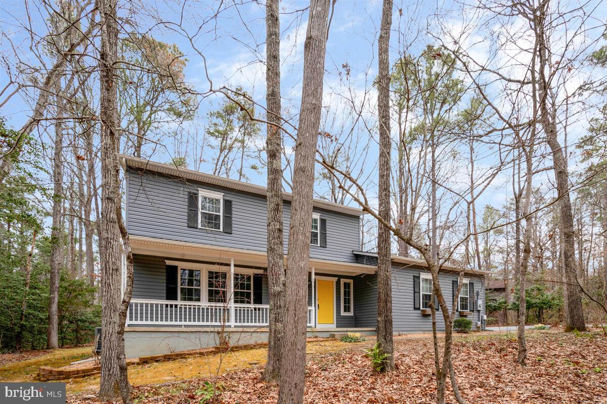 44576 Cedar Court California, MD 20619 - Photo 2 of 45 front view of a house with a trees