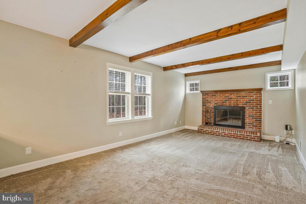 44576 Cedar Court California, MD 20619 - Photo 21 of 45 an empty room with a fireplace and a window