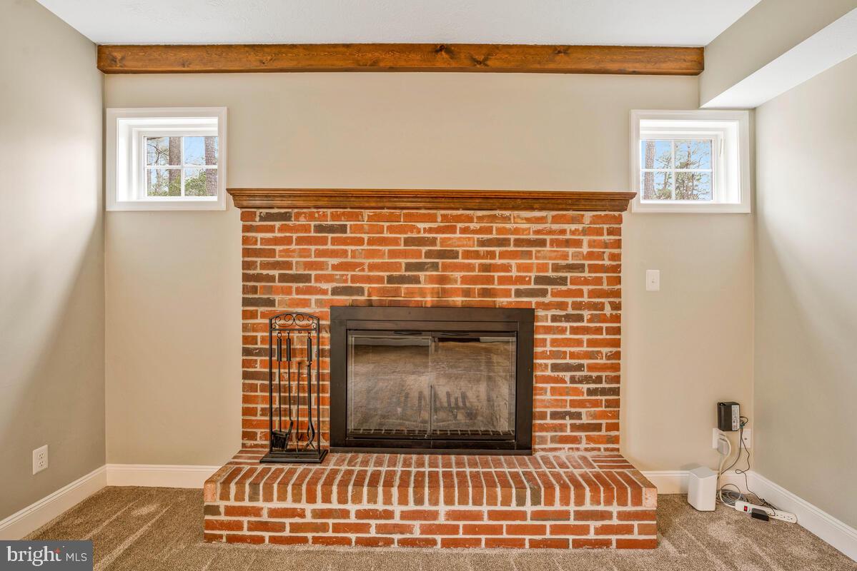 44576 Cedar Court California, MD 20619 - Photo 22 of 45 a living room with a fireplace
