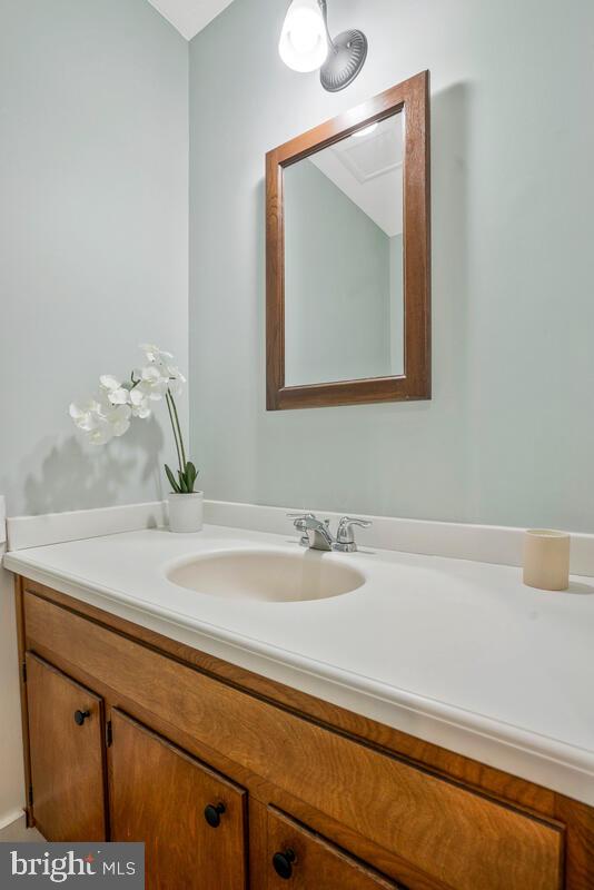 44576 Cedar Court California, MD 20619 - Photo 23 of 45 a bathroom with a sink and a mirror
